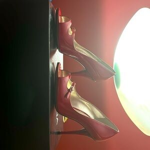 Dolce & Gabbana Rosso (red) patent leather peep-toe heels.